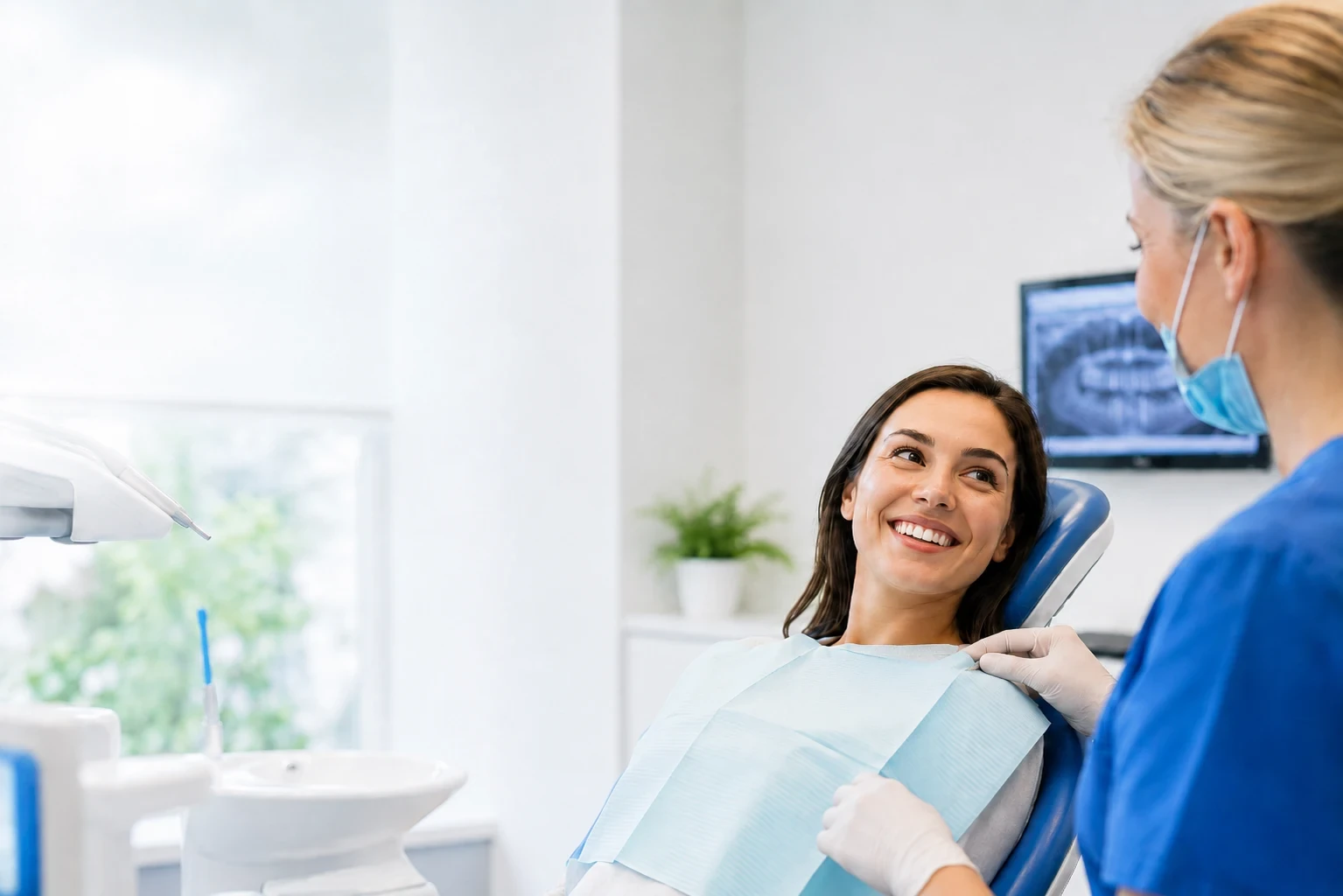 Calm dentist speaking with a relaxed patient in a dental practice