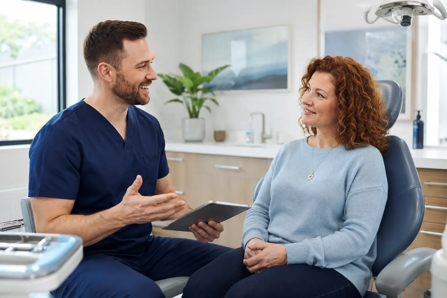 Calm dentist explaining dental sedation options to a patient